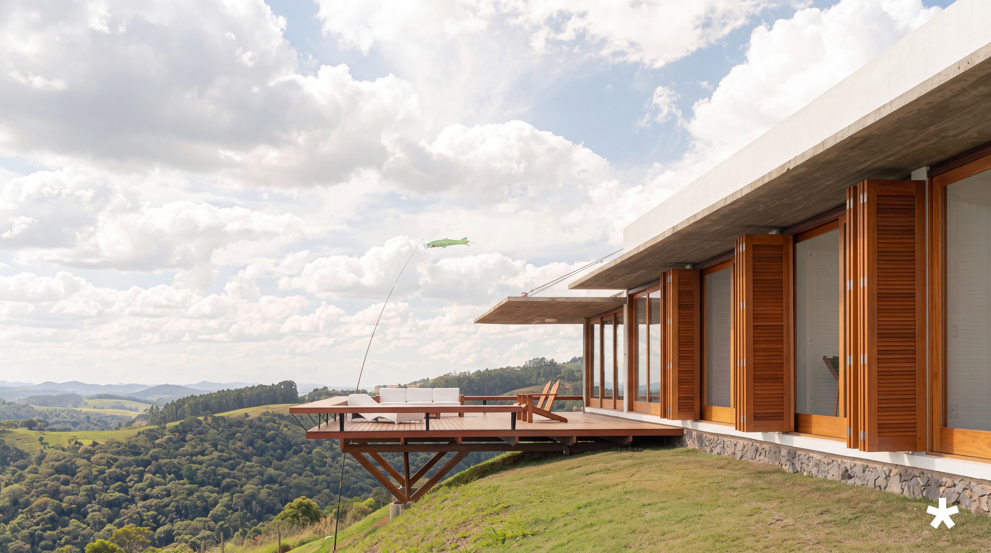 A modern timber-clad house with clean glazing under a bright sky